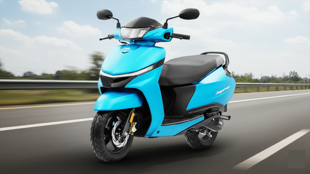 TVS Jupiter Scooter 2025: बेहतरीन फीचर्स के साथ कुछ कमियाँ भी जानें 2 TVS Jupiter Scooter 2025 front view showing LED headlamp, elegant design and alloy wheels during road test.