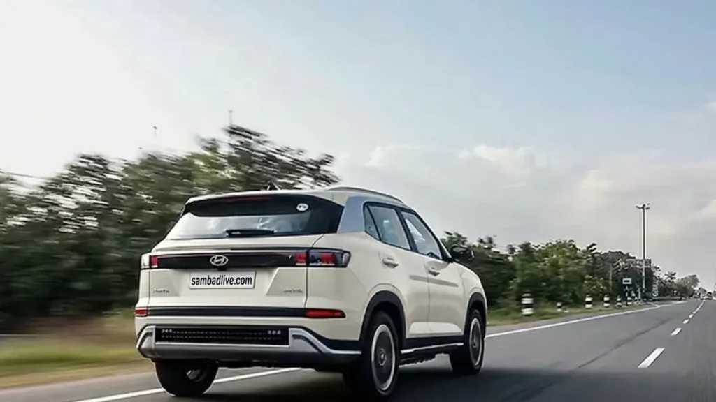 Hyundai Creta Electric Will Shock You With Its Range and Features 2 Hyundai Creta Electric driving on an open highway, showing rear exterior design with LED tail lamps and modern SUV styling.